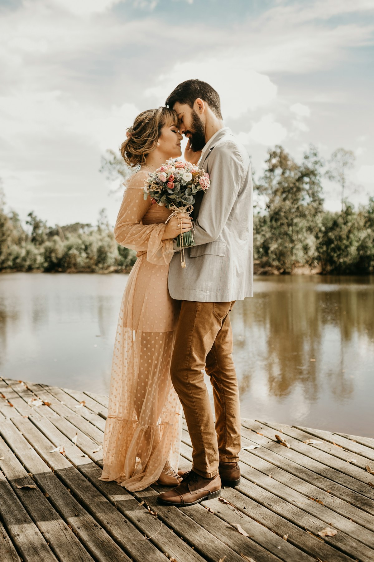 Couple standing on a pier
